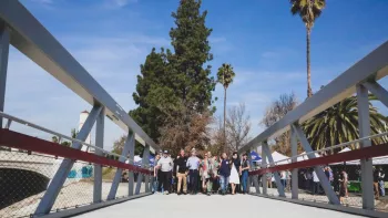 people on a bridge posing for a picture